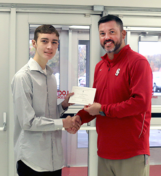  Principal Williams presents Dylan Harris with his certificate